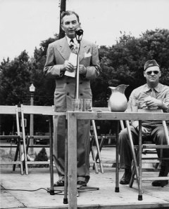 Longtime Richmond Heights Mayor Lee Duggan, who served the city for 24 years, gives a speech as a serviceman listens.   Undated photo by Bantel-Zucker Studio, courtesy of Eileen Duggan, Mary Espenschield and Vince Stuart
